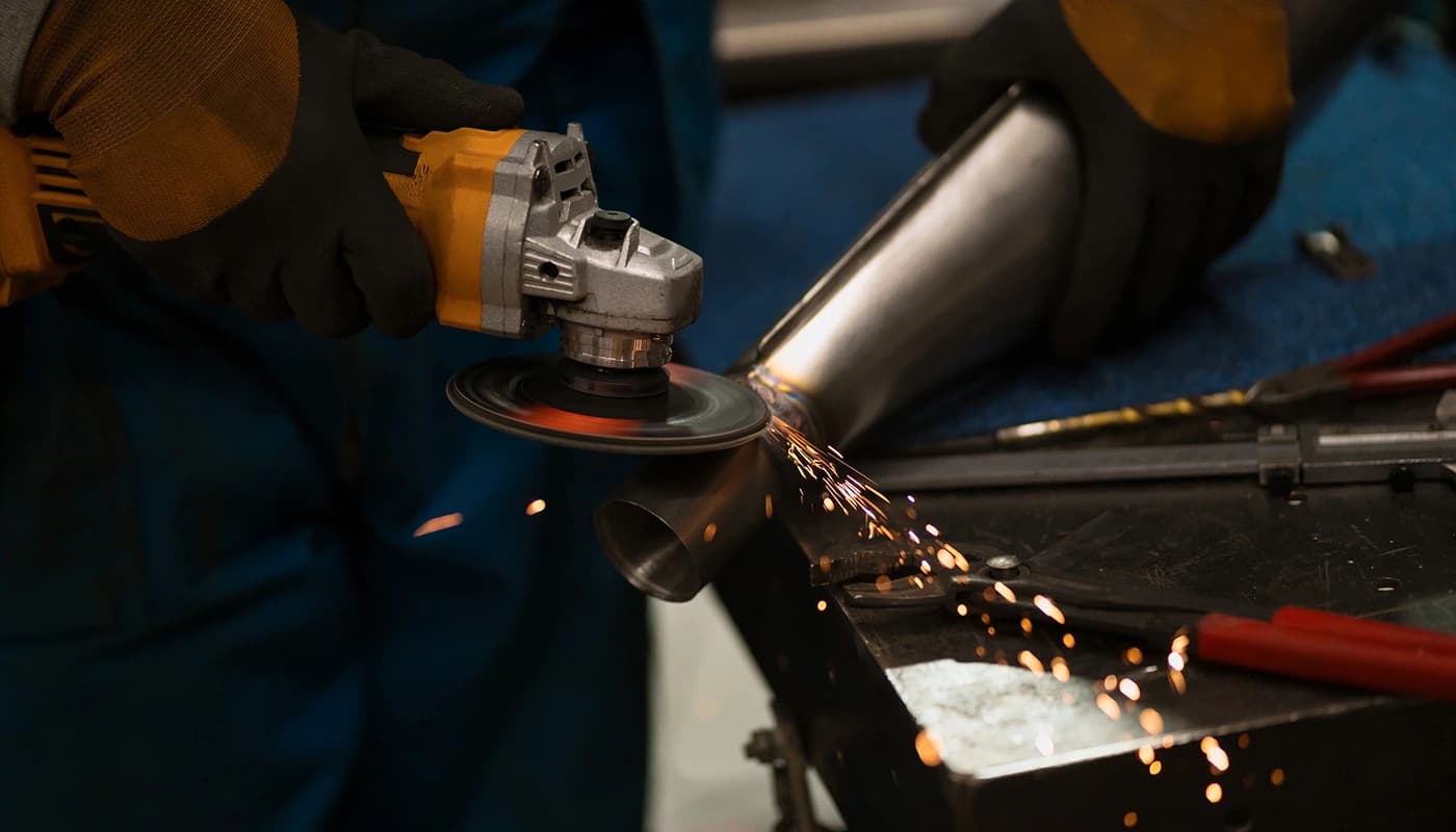 Grinding sparks off a welded steel fabrication